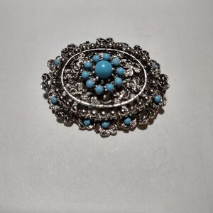Intricate Silver and Blue Floral Brooch